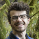 man smiling into camera.
