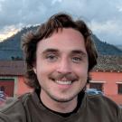 man in front of mountain